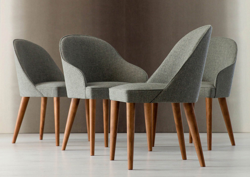 Sedie Judy in stoffa con gambe in legno Sedie Judy in stoffa con gambe in legno massello finitura rovere tinto noce